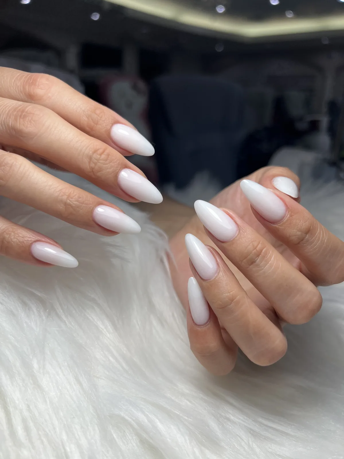 Milky pink-to-white French ombré on long almond nails